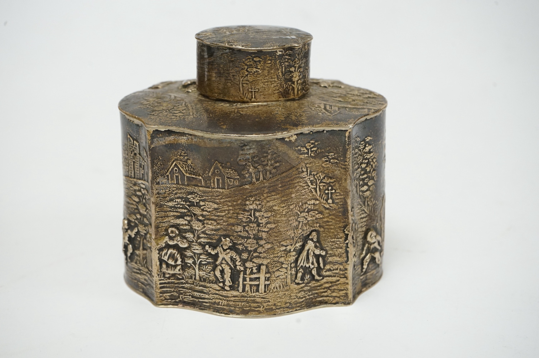A George V embossed silver serpentine tea caddy, by HF, Chester, 1911, height 98mm, 6.3oz. Condition - fair